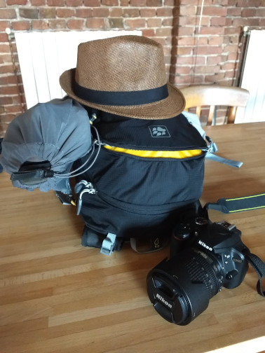 Backpack, hat, and camera packed for a trip around Europe