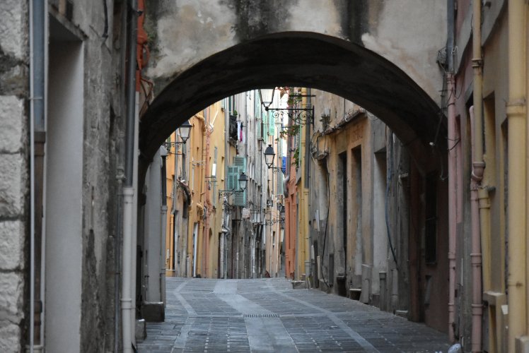 Narrow arched street entrance in Menton