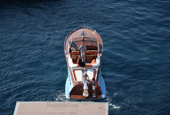Luxury motorboat floating beside a pier in Monaco